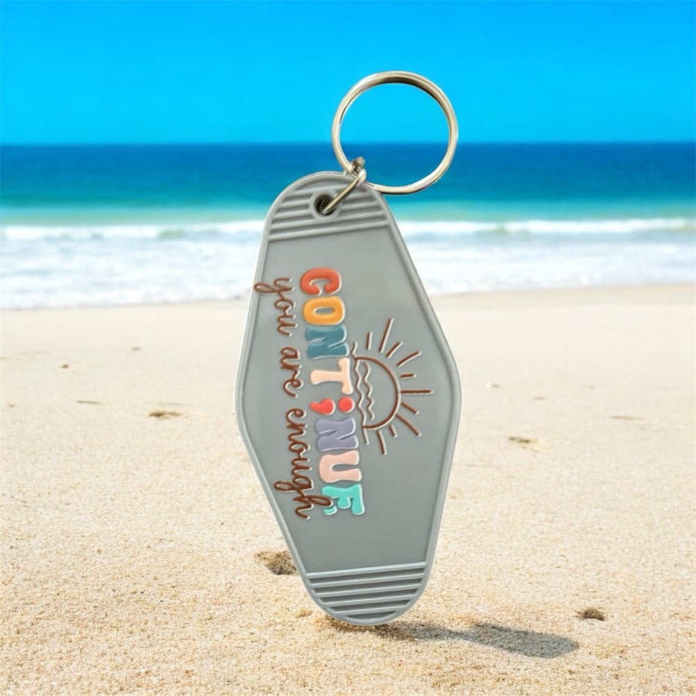 Gray Keychain with Motivational Message